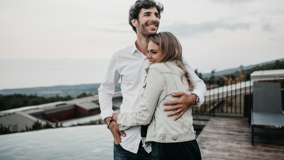 man and woman hugging each other